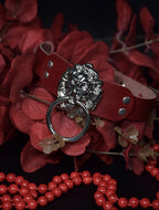 LION’S HEAD CHOKER: Red wine