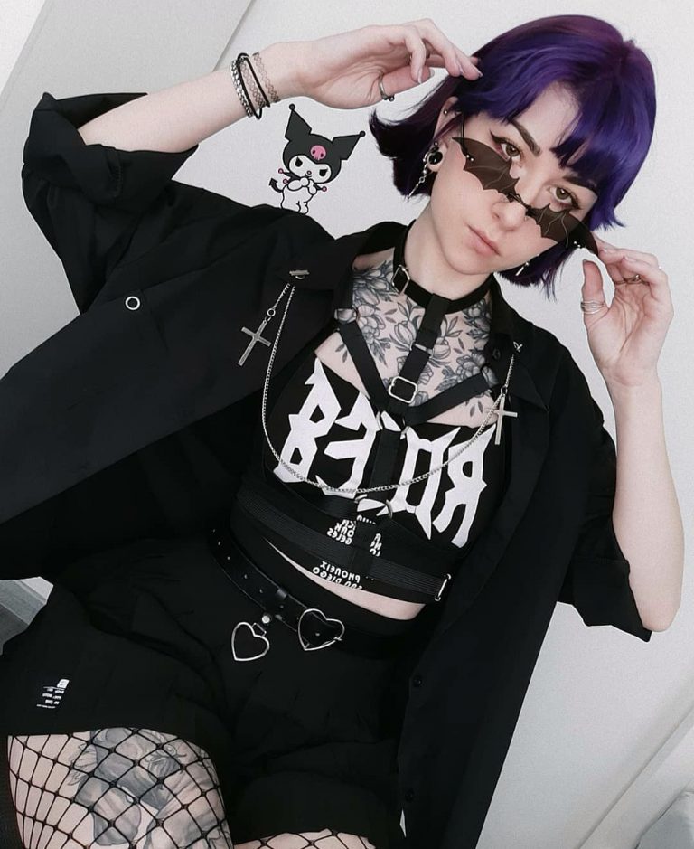 gothic girl in aslard body harness wearing sunglasses
