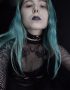 pastel goth girl in fishnet and leather choker