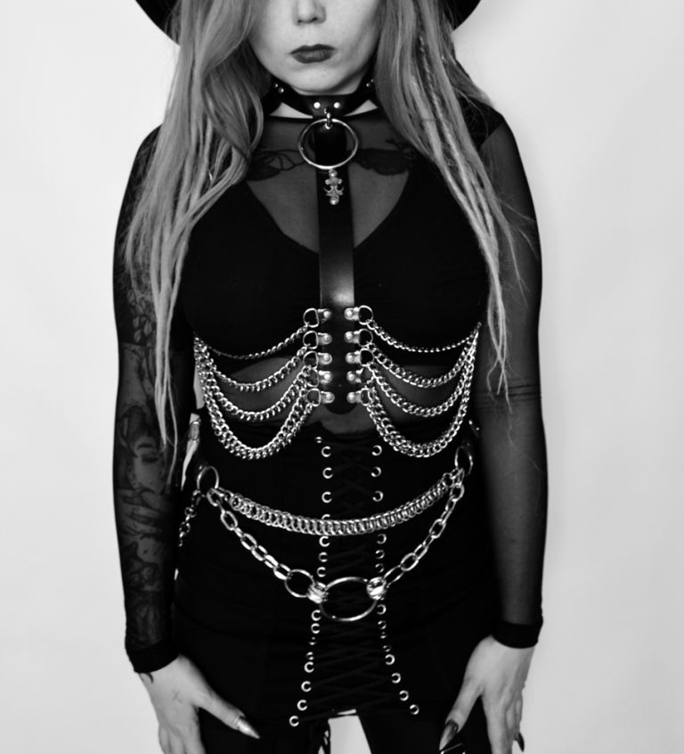 leather harness with chain ribs on metal goth girl
