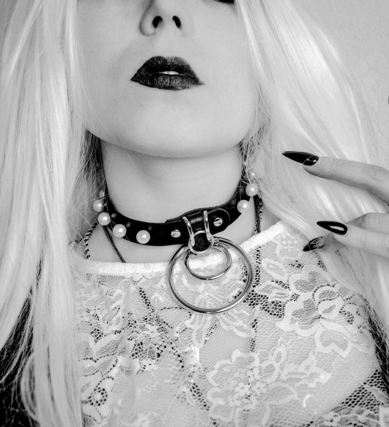gothic lady with white hair and leather choker