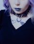 Pastel goth girl with violet hair wearing leather choker