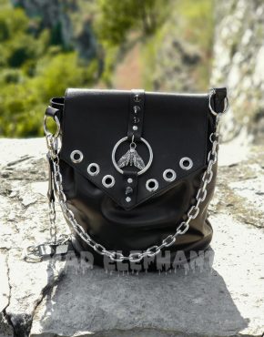 handmade leather bag with moth pendant and eyelets