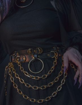 belt with golden hardware with black dress