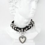 spiked choker decorated with d-rings and heart pendant