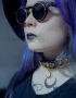 pastel goth girl in sunglasses and leather gold choker