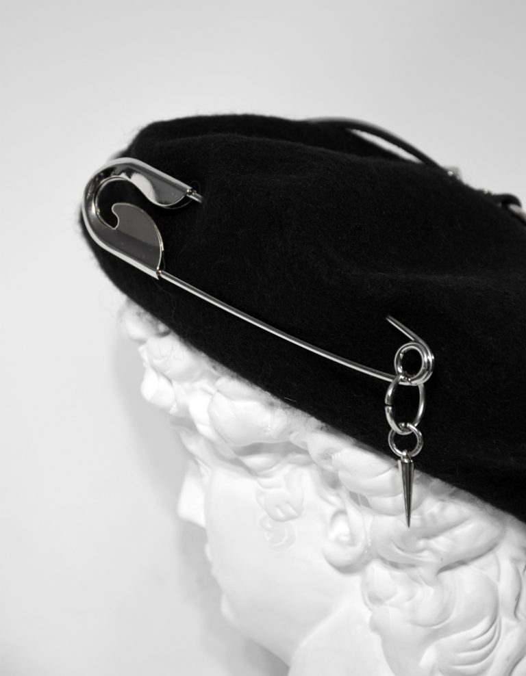 beret with cool hat design with big metal pin